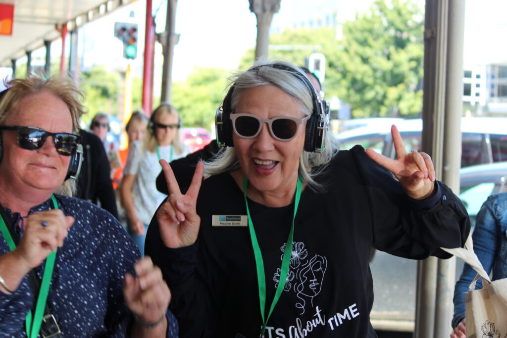 Women feeling the joy of Silent Disco Citywalk in Invercargill