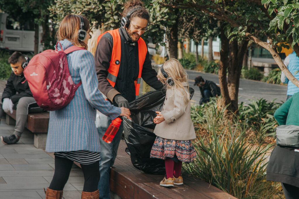 papaya stories crew dancing with people on a silent disco city clean up