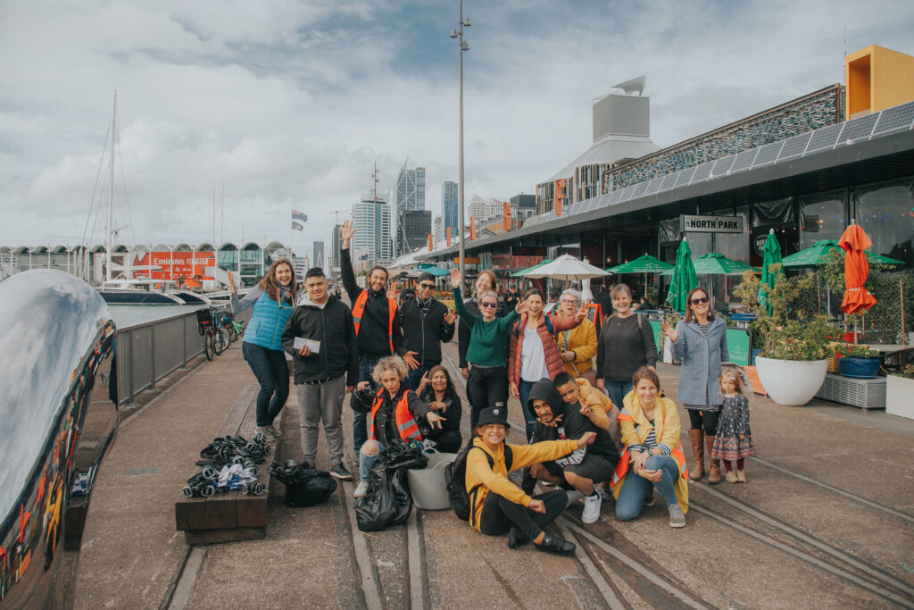 a group of happy people at silent disco city clean up